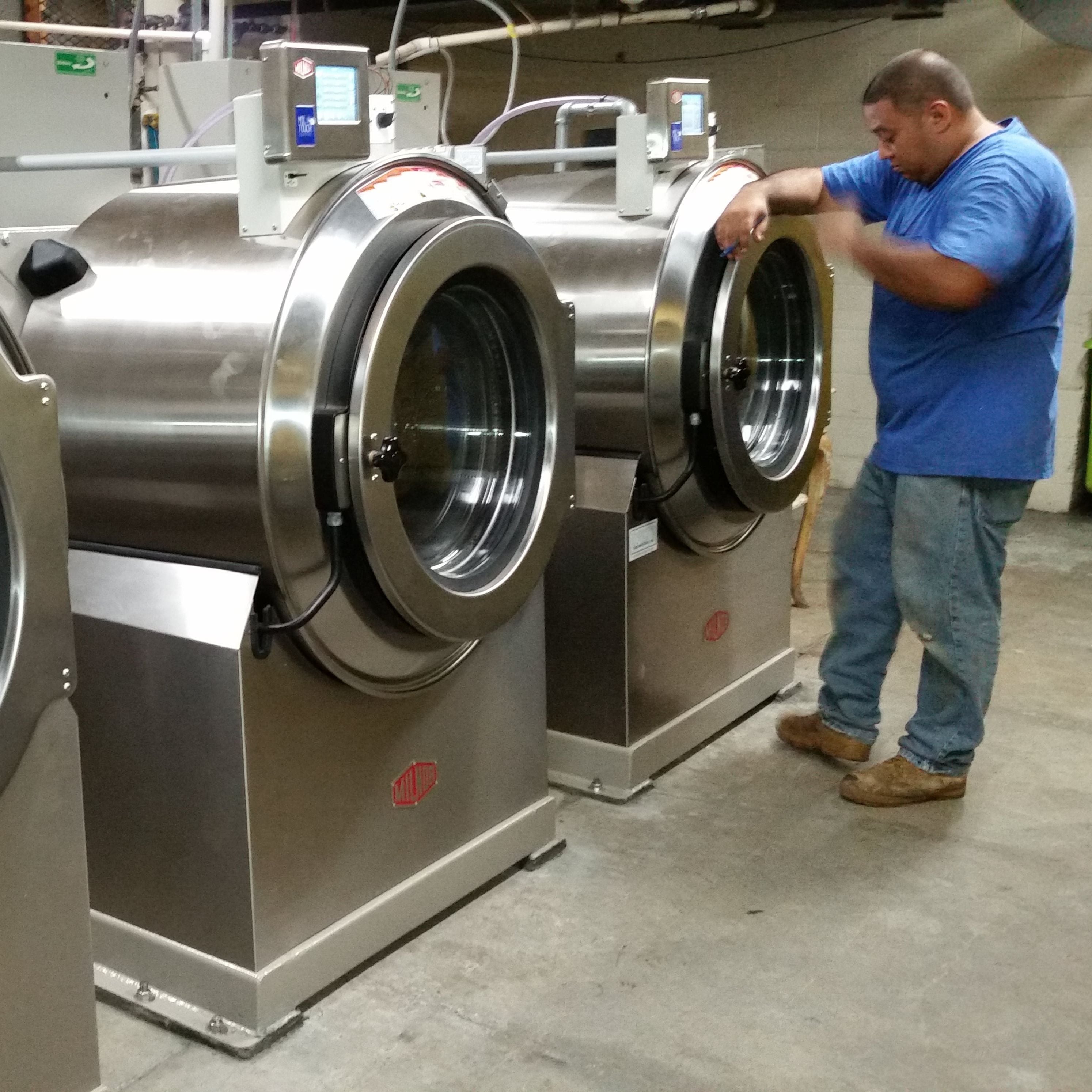 Man inspecting Hpt water heater